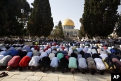 FILE - Palestinians pray inside the Al-Aqsa Mosque compound in Jerusalem's Old City, July 27, 2017.