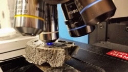 A cut sample of fulgurite being analyzed using Raman spectroscopy at the University of Chicago. (Yale University)