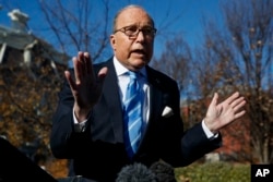 White House chief economic adviser Larry Kudlow talks with reporters about trade negotiations with China, at the White House, Dec. 3, 2018, in Washington.