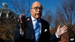 White House chief economic adviser Larry Kudlow talks with reporters about trade negotiations with China, at the White House, Dec. 3, 2018, in Washington. 