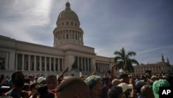 People protest in front of the Capitol in Havana, Cuba, Sunday, July 11, 2021. (AP Photo/Ramon Espinosa)