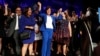 House Minority Leader Nancy Pelosi of Calif., smiles as she is cheered by a crowd of Democratic supporters during an election night returns event at the Hyatt Regency Hotel, on Nov. 6, 2018, in Washington.