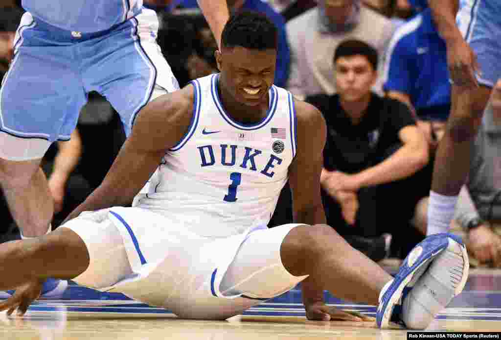 Duke Blue Devils forward Zion Williamson reacts after falling when his shoe split during the first half against the North Carolina Tar Heels at Cameron Indoor Stadium om Durham, North Carolina.