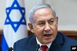 Israel Prime Minister Benjamin Netanyahu addresses the weekly cabinet meeting in his Jerusalem office, Aug. 12, 2018.