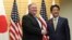 U.S. Secretary of State Mike Pompeo, left, shakes hands with Japanese Prime Minister Shinzo Abe at Abe's office in Tokyo, Oct. 6, 2018.