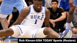 Feb 20, 2019; Durham, NC, USA; Duke Blue Devils forward Zion Williamson (1) reacts after falling during the first half against the North Carolina Tar Heels at Cameron Indoor Stadium. 