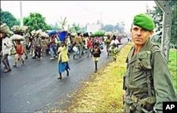 A French soldier watches as refugees flee Rwanda in July 1994 … Much of Sky Like Sky is concerned with the traumatic experience of crossing borders into the unknown