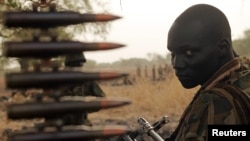 A South Sudan's army, or the SPLA, soldier sits in a truck on the frontline in Panakuach, Unity State,April 24, 2012. 