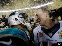 Carolina Panthers’ Cam Newton, left, talks to Denver Broncos’ Peyton Manning (18) after the NFL Super Bowl 50 football game Sunday, Feb. 7, 2016.