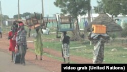 Residents of the South Sudanese town of Bentiu flee toward the U.N. base after fresh fighting and targeted killings rocked the town.