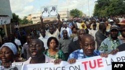 Malian journalists take to the streets of Bamako during a day of "Dead Press" to protest recent attacks against journalists by armed men believed to be linked to the former junta, July 17, 2012.