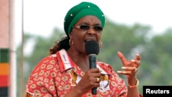 Zimbabwe's First Lady Grace Mugabe addresses her maiden political rally in Chinhoyi after she was nominated to head the Zanu PF ruling party women's league two months ago, Oct. 2, 2014. 