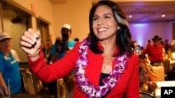 FILE - In this Nov. 6, 2018, file photo, Rep. Tulsi Gabbard, D-Hawaii, greets supporters in Honolulu. Gabbard has announced she’s running for president in 2020. 