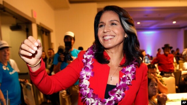 FILE - Rep. Tulsi Gabbard, D-Hawaii, greets supporters in Honolulu, Nov. 6, 2018. Gabbard has announced she’s running for president in 2020.