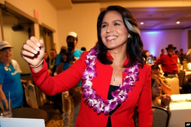 FILE - In this Nov. 6, 2018, file photo, Rep. Tulsi Gabbard, D-Hawaii, greets supporters in Honolulu. Gabbard has announced she’s running for president in 2020.