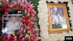 Portraits of Bernard Krisher, founder of The Cambodia Daily, are on display at his funeral ceremony in Phnom Penh, Cambodia, March 19, 2019. (Kann Vicheika/VOA Khmer)