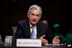 FILE - Jerome Powell testifies during a Senate Banking, Housing, and Urban Affairs Committee confirmation hearing on Capitol Hill, Nov. 28, 2017.