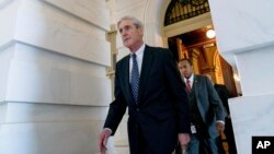 FILE - Special counsel Robert Mueller, in charge of investigating Russian interference in the 2016 U.S. presidential election and possible collusion between Moscow and the Trump campaign, departs Capitol Hill, in Washington, June 21, 2017.