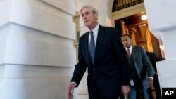 FILE - Special counsel Robert Mueller, in charge of investigating Russian interference in the 2016 U.S. presidential election and possible collusion between Moscow and the Trump campaign, departs Capitol Hill, in Washington, June 21, 2017.