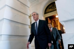 FILE - Special counsel Robert Mueller, in charge of investigating Russian interference in the 2016 U.S. presidential election and possible collusion between Moscow and the Trump campaign, departs Capitol Hill, in Washington, June 21, 2017. So far, Mueller has offered no evidence of collusion between the Trump campaign and Russia but no one knows yet what his report holds.