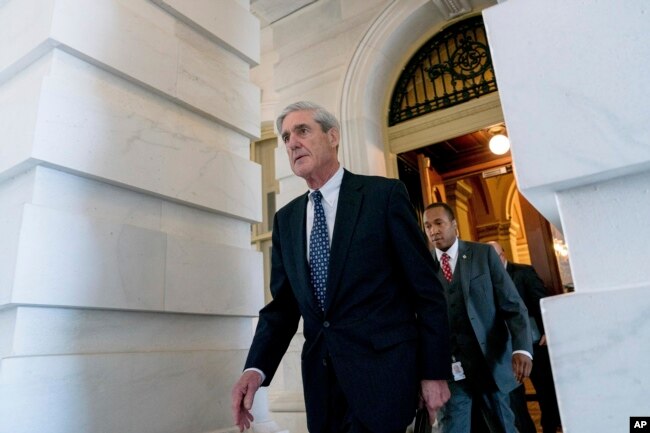 FILE - Special counsel Robert Mueller, in charge of investigating Russian interference in the 2016 U.S. presidential election and possible collusion between Moscow and the Trump campaign, departs Capitol Hill, in Washington, June 21, 2017. So far, Mueller has offered no evidence of collusion between the Trump campaign and Russia but no one knows yet what his report holds.