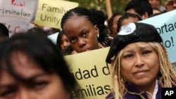 Immigrant rights supporters attend a pro-immigration rally in New York City, 19 Oct 2010