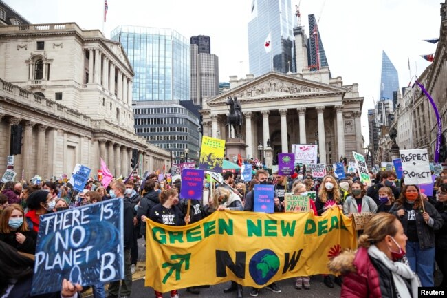 Demonstrators participate in a protest outside the Bank of England, as the UN Climate Change Conference (COP26) takes place, in London, Britain, Nov. 6, 2021.