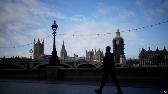 This file photo shows a view of the scaffolded Elizabeth Tower, known as Big Ben, and the Houses of Parliament from the other side of the River Thames, in London, Thursday, on Oct. 14, 2021. (AP Photo/Matt Dunham, File)