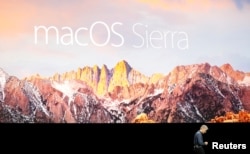 Craig Federighi, Senior Vice President of Software Engineering for Apple Inc, discusses the macOS Sierra at the company's World Wide Developers Conference in San Francisco, California, U.S. on June 13, 2016.