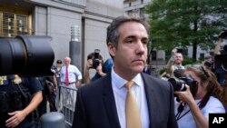 FILE - Michael Cohen, former personal lawyer to President Donald Trump, leaves federal court after reaching a plea agreement in New York, Aug. 21, 2018.