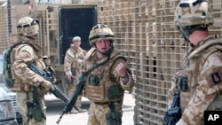British soldiers patrol the streets of Basra, southeast of Baghdad,15 Jul 2008