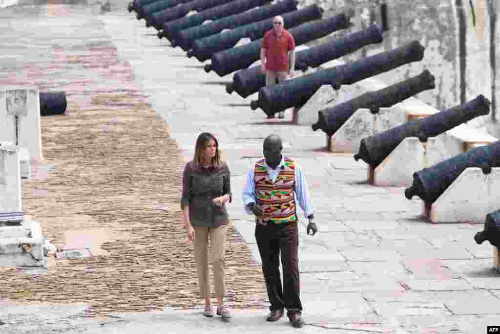 First Lady Melania Trump (L) tours with Museum Educator Kwesi Essel-Blankson, the Cape Coast Castle, a former slave trading fort, in Cape Coast, Ghana.