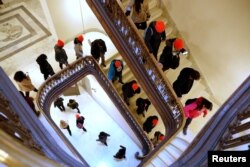 Demonstrators calling for new protections for so-called "Dreamers," undocumented children brought to the U.S. by their immigrant parents, walk through a Senate office building on Capitol Hill in Washington, Jan. 17, 2018.