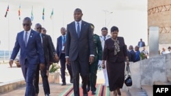 President of Mozambique Daniel Chapo, center, arrives for a summit in Harare, Zimbabwe, Jan. 31, 2025. Mozambican authorities have assured refugees who fled to Malawi after post-election unrest that peace has been restored and they are welcome to return home.