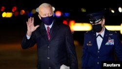 FILE - President Joe Biden waves as he arrives at Newcastle, Del., Feb. 5, 2021.