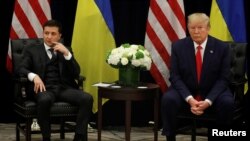 Ukraine's President Volodymyr Zelenskiy and U.S. President Donald Trump face reporters during a bilateral meeting on the sidelines of the 74th session of the United Nations General Assembly in New York, Sept. 25, 2019. 