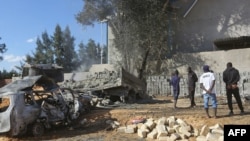 This picture taken on Nov. 18, 2019 shows the aftermath of a reported air strike on a factory south of the Libyan capital Tripoli.