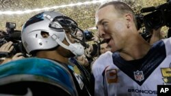 Carolina Panthers’ Cam Newton, left, talks to Denver Broncos’ Peyton Manning (18) after the NFL Super Bowl 50 football game Sunday, Feb. 7, 2016.