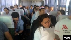 Most of the journalists that came to see the opening of the Suez Canal expansion made it to the party, but press badges were lost for this sad bunch, so they headed back to Cairo, Aug. 6, 2015. (Credit: Heather Murdock) 