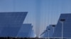 Fields of heliostat mirrors reflect sunlight at the site of Dunhuang Shouhang 100MW Tower Solar Thermal Power Generation Project, during an organized media tour to Dunhuang Photovoltaic Industrial Park, in Gansu province, China, Oct. 16, 2024. 