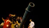 People surround a Turkish army tank in Ankara, Turkey, July 16, 2016.