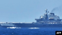 This recent handout photo released on Sept. 18, 2024 by Japan's Ministry of Defence Joint Staff Office Public Relations shows the Chinese aircraft carrier Liaoning at sea in waters near Japan's southern Okinawa region.