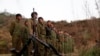 Rebel soldiers of Myanmar National Democratic Alliance Army (MNDAA) gather at a military base in Kokang region, March 11, 2015. 