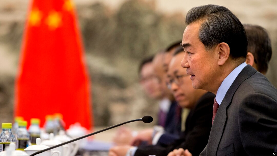 FILE - Chinese Foreign Minister Wang Yi speaks during a meeting at the Ministry of Foreign Affairs in Beijing, Jan. 27, 2016. He suggests that global growth, not politics, should be the focus of the G-20 summit in early September in the Chinese city of Hangzhou.