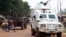Police officers from the United Nations Multidimensional Integrated Stabilization Mission in the Central African Republic (MINUSCA) in an armored vehicle patrol a market in Bangui's Combattant district, Sept. 14, 2015.