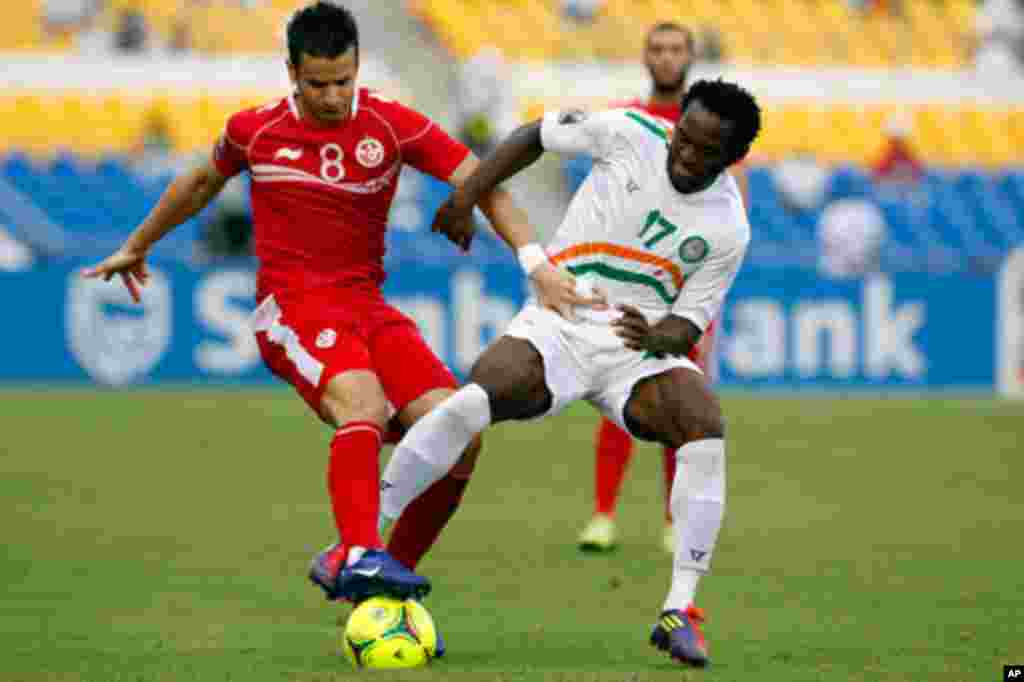 Tunisia's Khaled is challenged by Niger's Tonji during their African Cup of Nations soccer match in Libreville