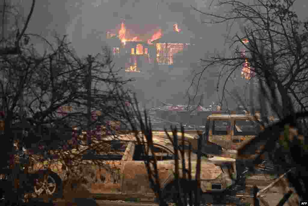 Fire consumes a home in Glen Ellen, California. Tens of thousands of acres and dozens of homes and businesses have burned in a widespread wildfire that is burning in Napa and Sonoma counties.