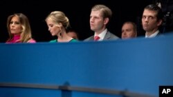 FILE - From left, Melania Trump, Ivanka Trump, Eric Trump, and Donald Trump, Jr., the family of Republican President-elect Donald Trump