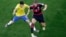 Brazil's Oscar (L) and Germany's Bastian Schweinsteiger vie for the ball during the World Cup semifinal soccer match between Brazil and Germany at Mineirao Stadium in Belo Horizonte, Brazil, July 8, 2014.