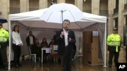 Colombia's President Juan Manuel Santos speaks after after voting in a referendum to decide whether or not to support the peace deal he signed with rebels of the Revolutionary Armed Forces of Colombia, FARC, in Bogota, Colombia, Oct. 2, 2016.